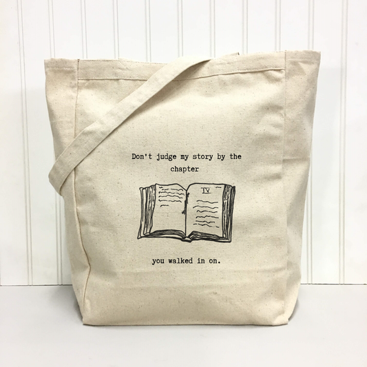 "Don’t judge my story by the chapter you walked in on." Tote Bag