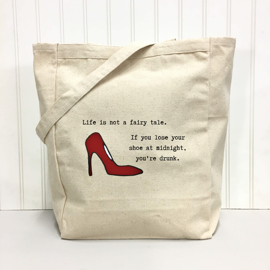 "Life is not a fairy tale. If you lose your shoe at midnight, you’re drunk." Tote Bag