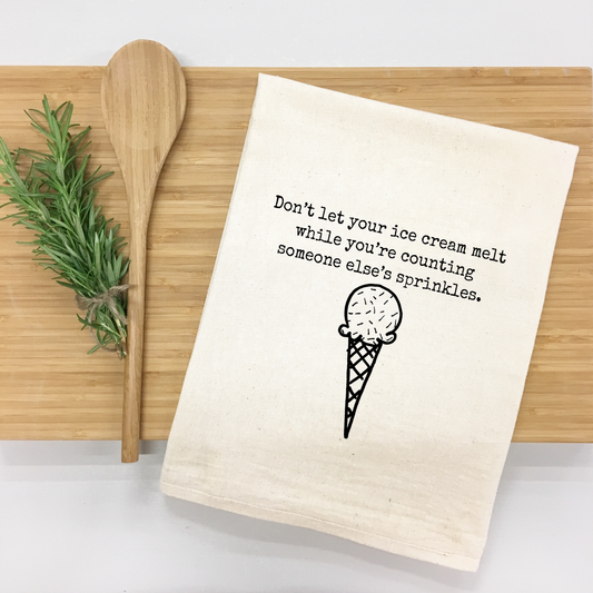 "Don't let your ice cream melt while you're counting someone else's sprinkles." Kitchen Towel