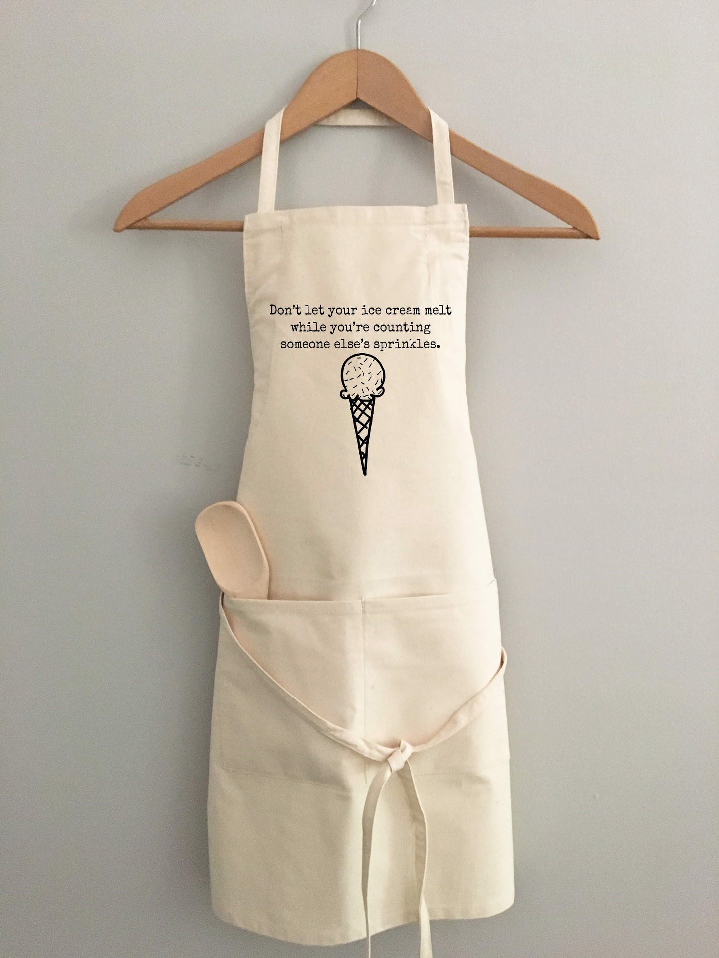 "Don't let your ice cream melt while you're counting someone else's sprinkles." Apron