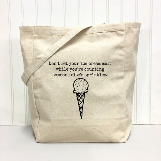 "Don't let your ice cream melt while you're counting someone else's sprinkles." Tote Bag